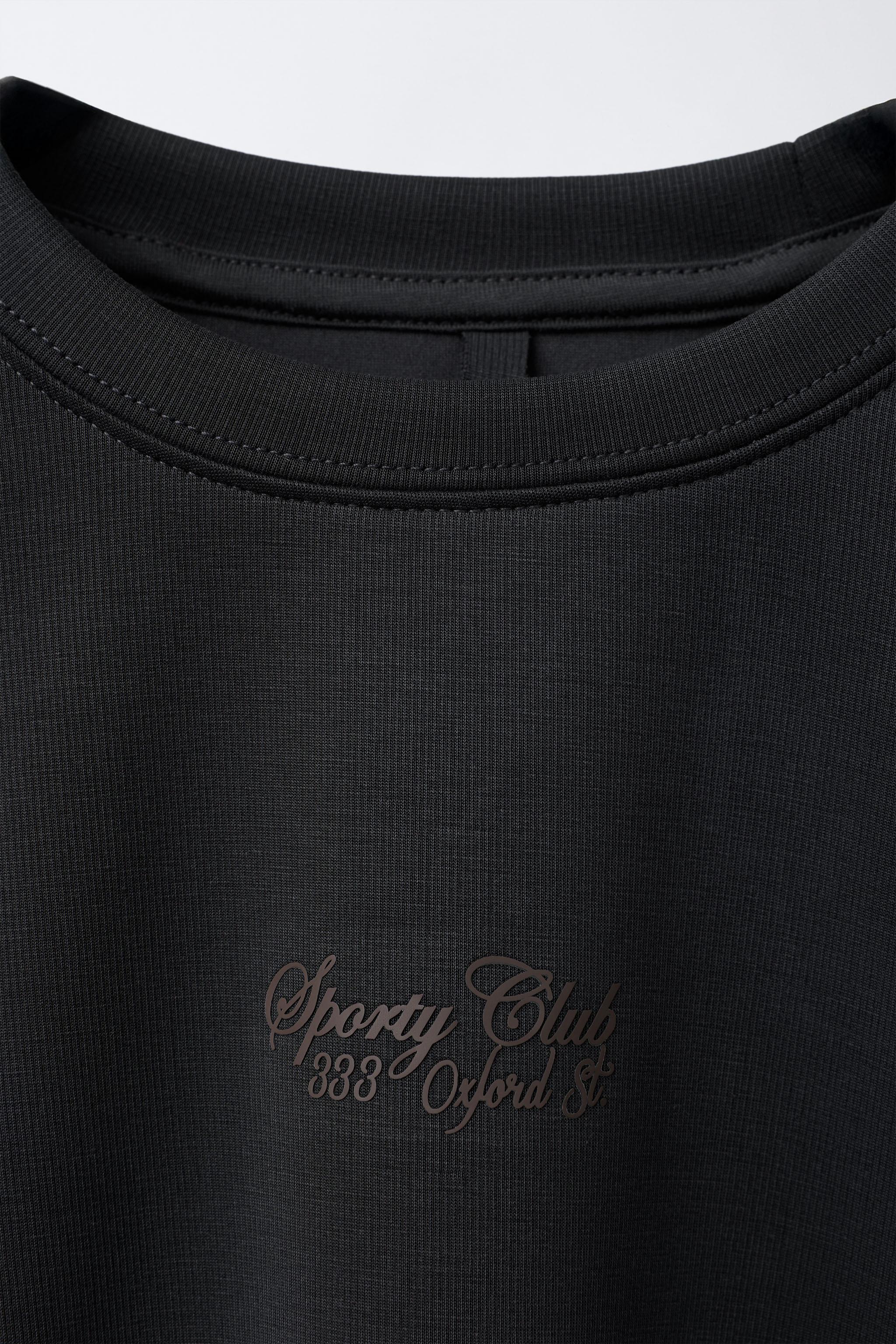 RAISED TEXT SWEATSHIRT